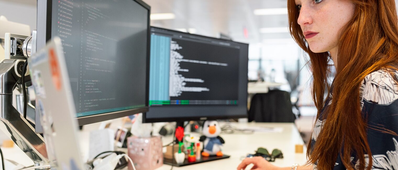 Woman Coding on Computer